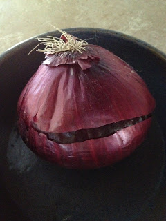 medium sized red onion in bowl